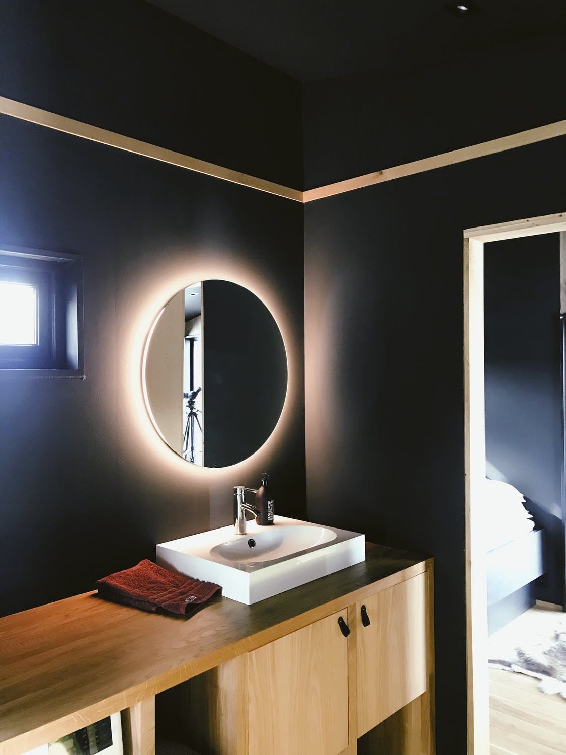 modern guest bathroom with modern mirror and vanity